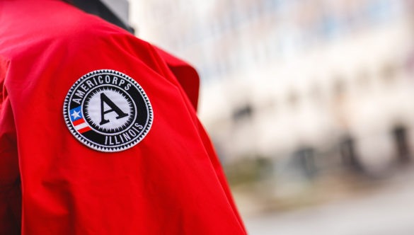 A close up of the AmeriCorps logo patch on the City Year jacket.