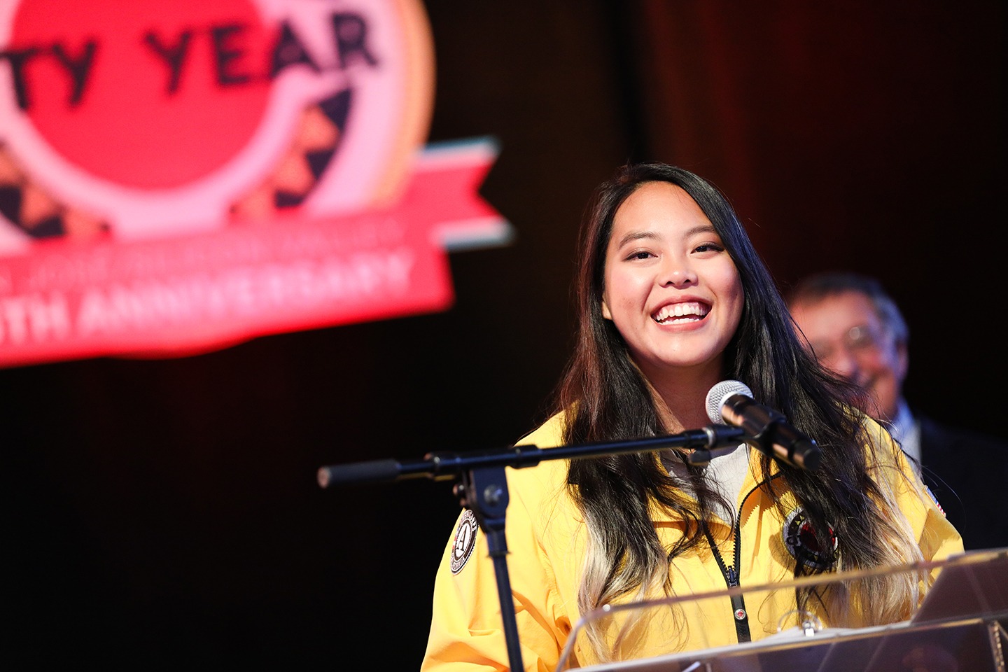 An AmeriCorps member speaks at a City Year event