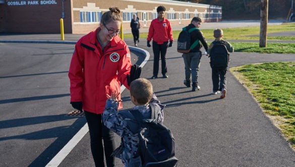 Shannon Luby greets students