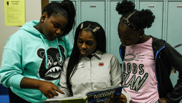 City Year Milwaukee AmeriCorps member tutoring students