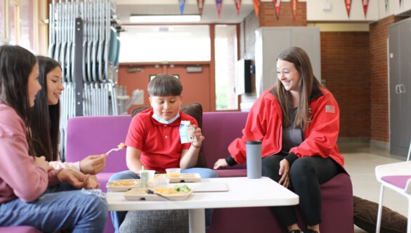 City Year AmeriCorps student success coach with students