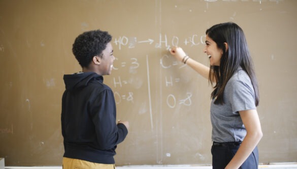 City Year AmeriCorps student success coach with student